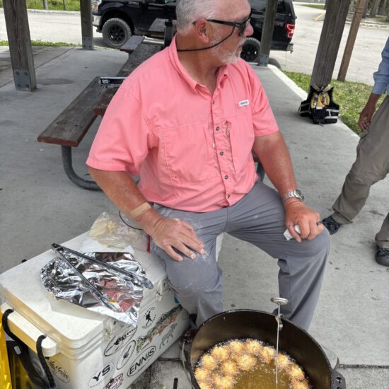 Guy Tending The Fry Pot